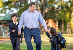 Sydney Catholic Schools Road Safety Education Officer, Andrew Sortwell, walking his children to school.
